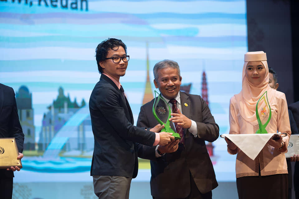 founder receiving awards for excellence in tourism