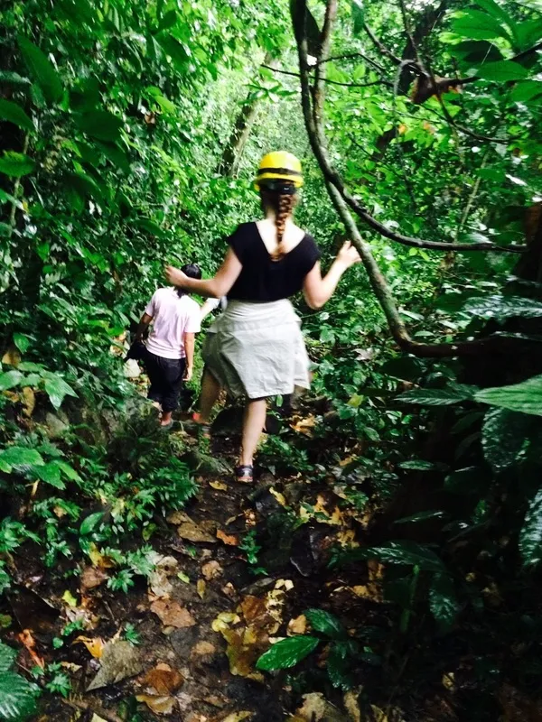Guests trekking a jungle trail at Orou Sapulot with a local guide, Sabah